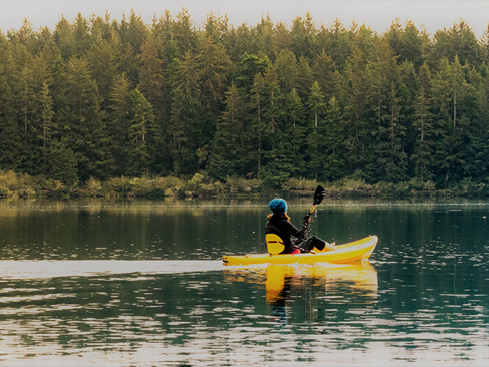 Kayaker in waterway.